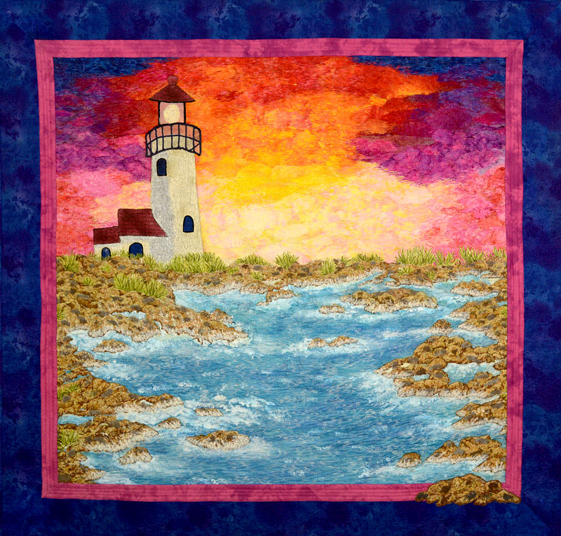 Lighthouse sunset art quilt by Joyce R. Becker